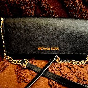 Michael Kors wallet on a strap